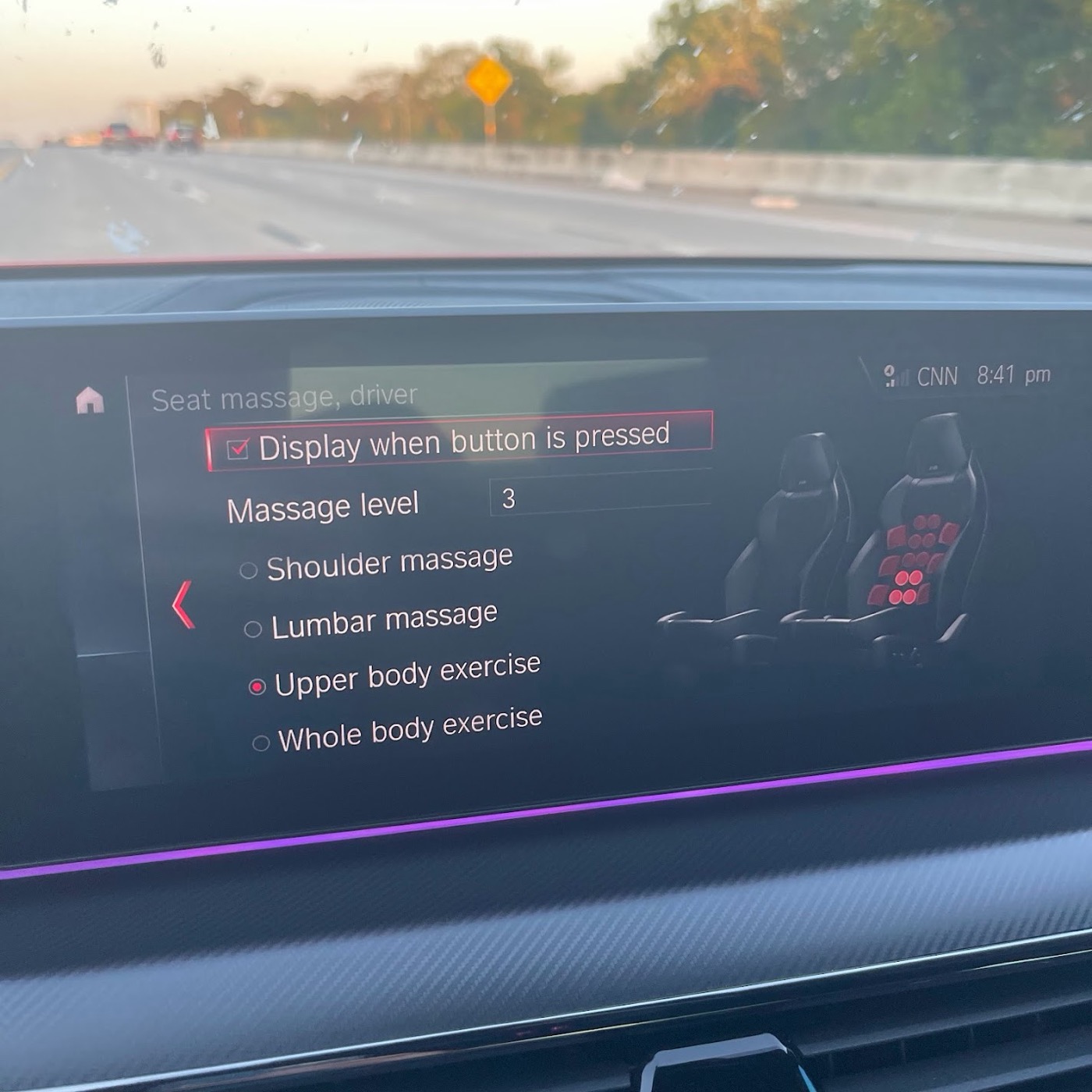 The M5's centre screen showing the driver seat massage menu: massage level 3, with shoulder massage, lumbar massage, upper body exercise and whole body exercise options