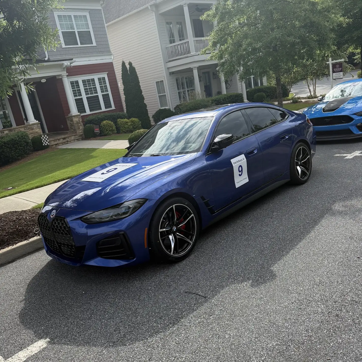 The M440i with its trackdays.ai door numbers, ready to go