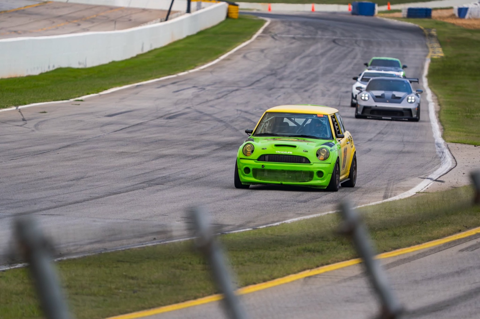 Rich's #18 Mini leading a train of Porsches at Road Atlanta